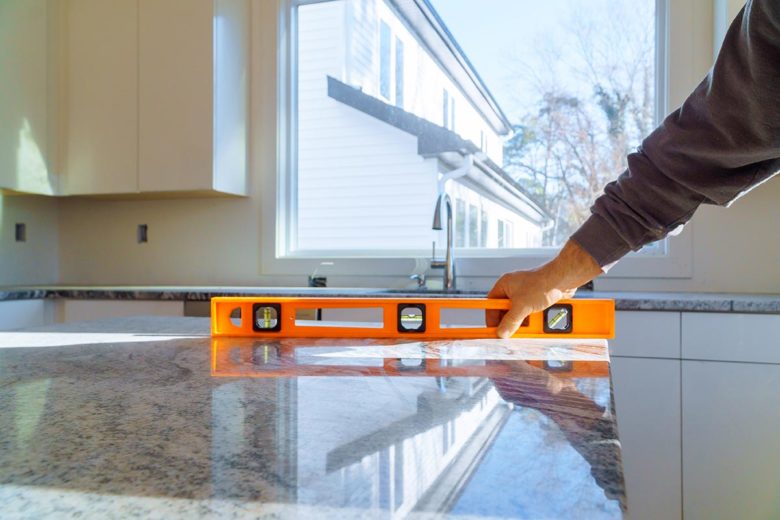 General Contractor using a level in Austin 