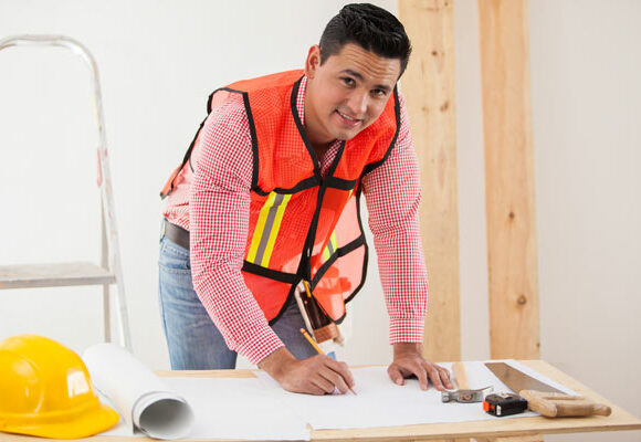 a professional Home Builder and General Contractor drawing plans in Austin