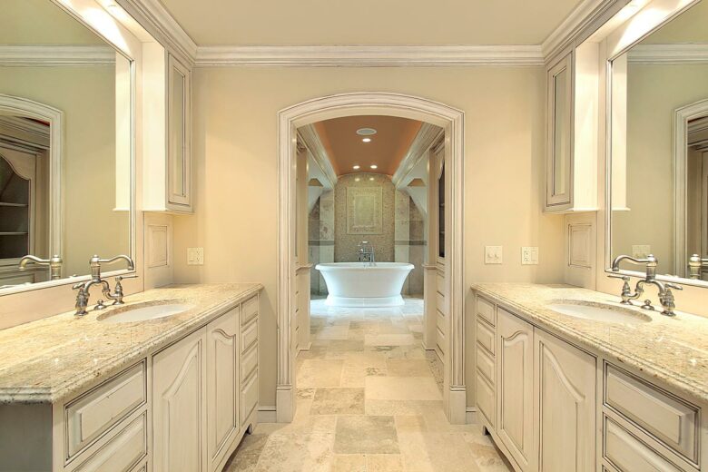 Bathroom Remodeling completed in Zilker, Austin with his and hers separate vanities in white and beige tones