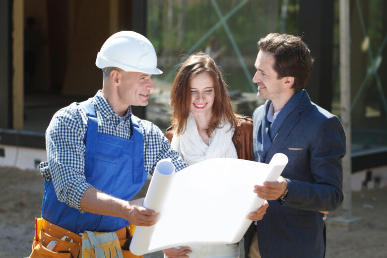 General Contractor and a Couple in Austin, TX Discussing a Custom Home Design