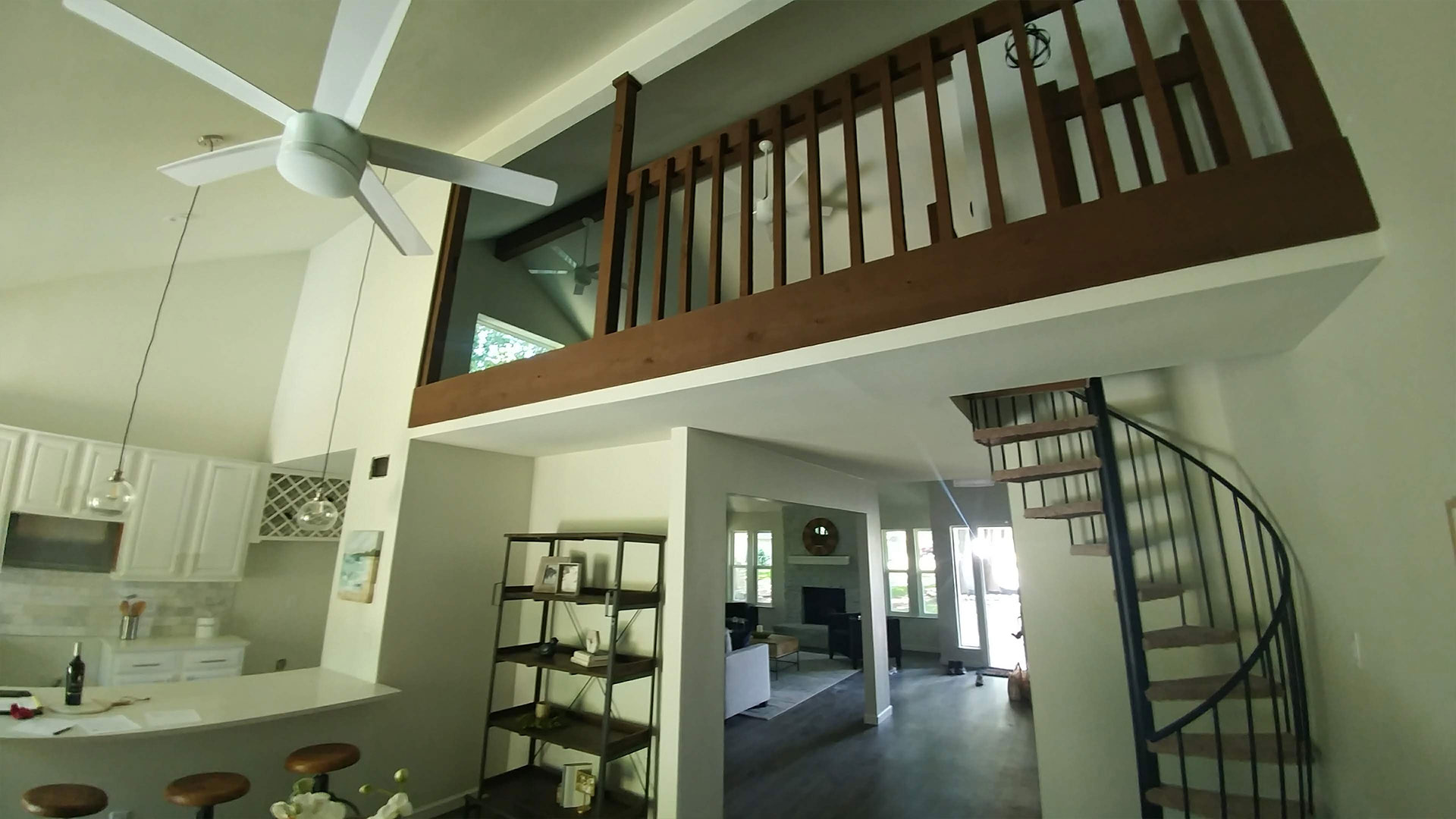 upstairs loft and staircase in kitchen by Home Builder In Austin
